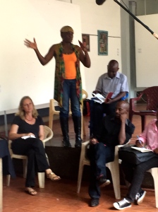 Lilian Nabulime starting her performance at the workshop presentations in Makerere Art Gallery